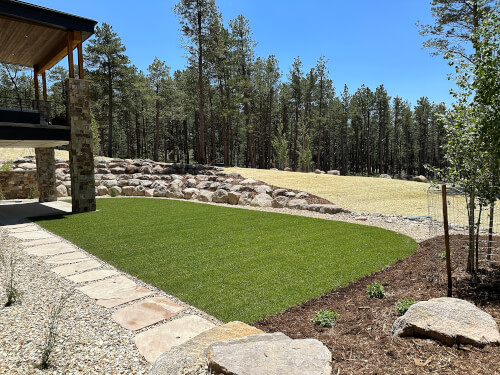 Lawnscape facing forest in Colorado